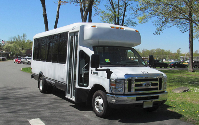 White 25 Passenger Shuttle Bus CITYNAME